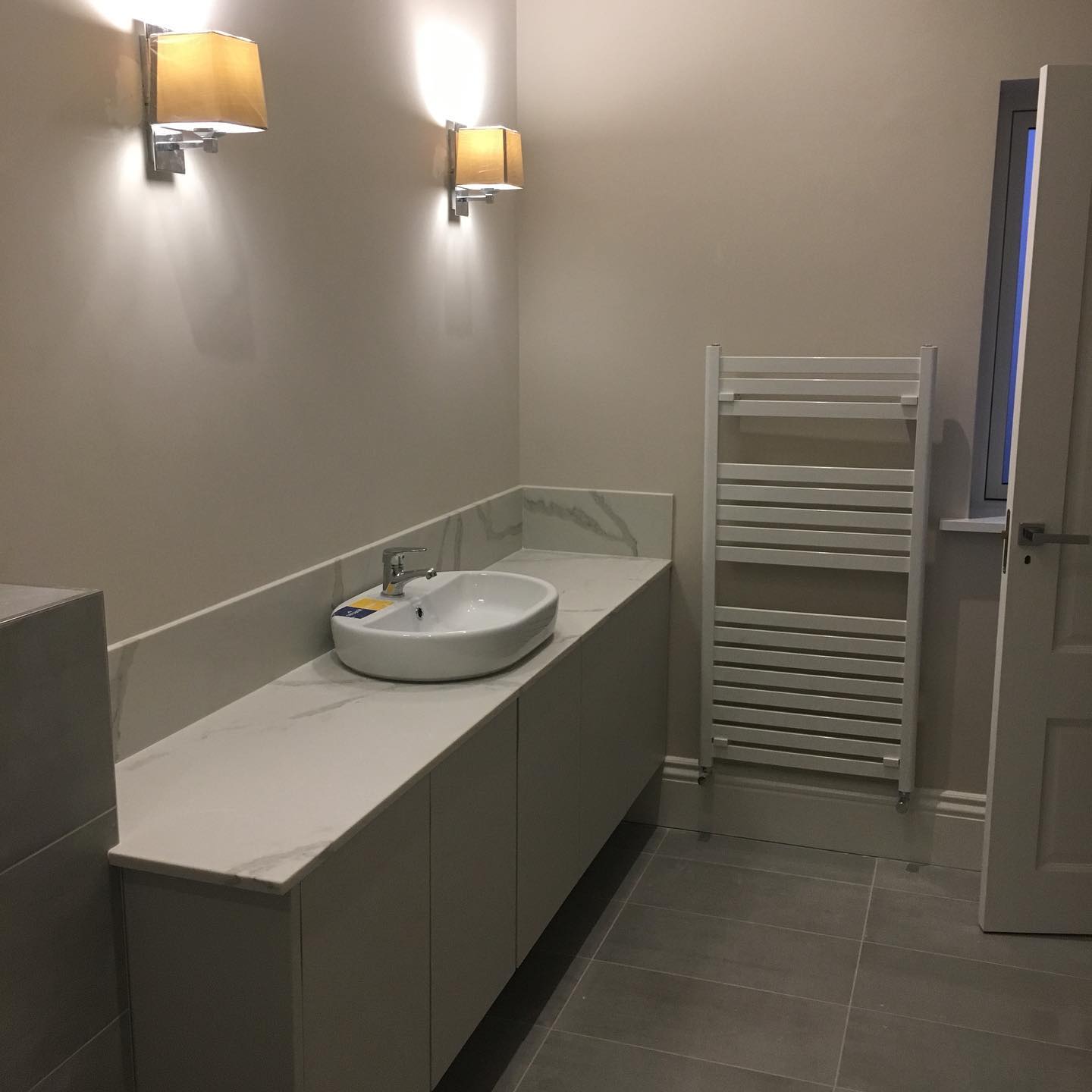 Timber bathroom vanity with countertop basin and wall-mounted tap